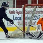 Reed Loree makes a save during the ProHybrid Goalie Training camp at the Treadwell Ice Arena last week.