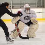 ProHybrid Goalie Training Camp instructor Zach Sikich works with adult goalie Darryl Tseu at the Treadwell Ice Arena last week.