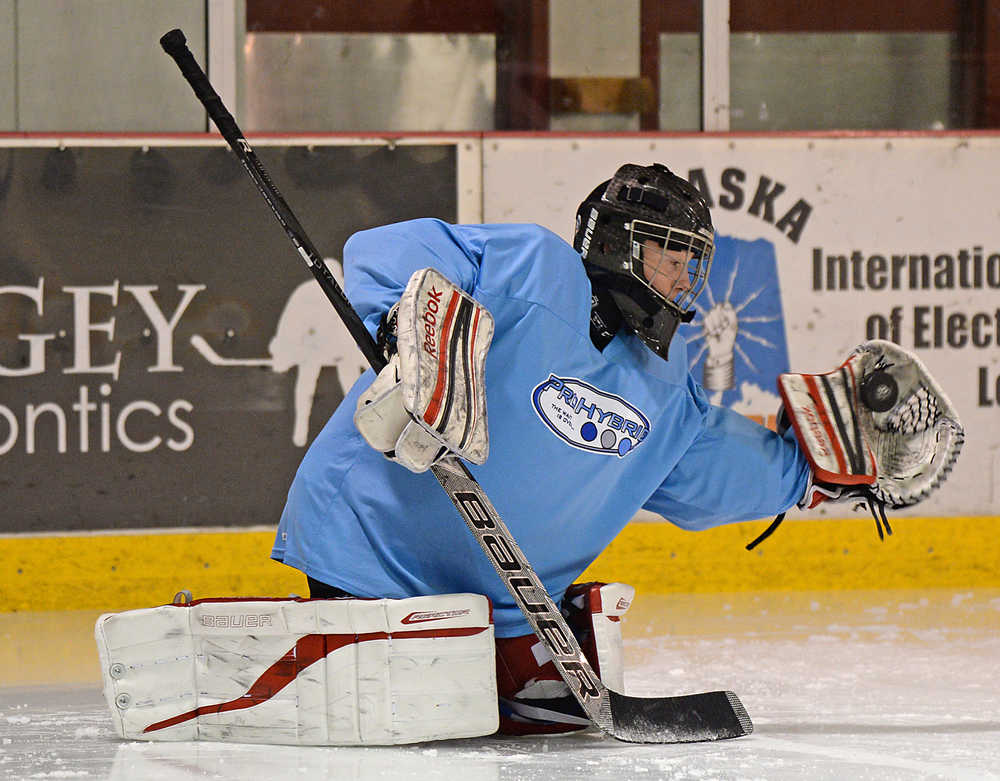Kyle Robinson-Farley Reed makes a save during the ProHybrid Goalie Training camp at the Treadwell Ice Arena last week.