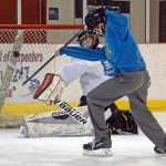 Cody Mitchell makes a save during the ProHybrid Goalie Training camp at the Treadwell Ice Arena last week.