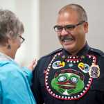 Juneau Police Department Sgt. Chris Burke is congratulated by Juneau City Manager Kim Kiefer during the department's Quarterly Awards Ceremony on Thursday. Sgt. Burke received a Purple Heart Award and a Medal of Valor for an arrest made at the Juneau International Airport.