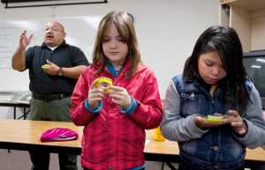 Instructor Dave Zungia, with the U.S. Forest Service, teaches Floyd Dryden Middle School sixth-graders Brittany Johnson and Mackenzie Christensen and their classmates how to use compasses on Wednesday as part of their three-day Outdoors Skills class at the Alaska Department of Fish and Game Juneau Hunter Education Shooting Complex. Volunteers assisting in teaching Juneau sixth-graders hailed from the ADF&G, U.S. Coast Guard, Taku River Sportman's Association and the U.S. Forest Service.