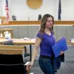 Kathleen Turley walks out of Juneau District Court on Thursday after closing statements in a lawsuit against her for springing fur traps owned by John Forrest on the Davies Creek trail in December. Judge Thomas Nave is to issue a judgment by noon on Friday.