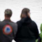 Heli, a four-month-old female harbor seal watches local families after her release at False Outer Point on Monday. Heli was found on July 20 suffering from a high temperature, dehydration, maternal neglect and multiple puncture wounds. She was flown to the Alaska SeaLife Center in Seward for rehabilitation.