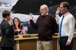 City Attorney Amy Mead swears in Loren Jones, center, and Jerry Nankervis into their second terms on the Assembly Tuesday night.