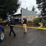 Police put up caution tape Wednesday morning at the scene where a murder suspect in the death of a 30-year-old man was taken into custody at