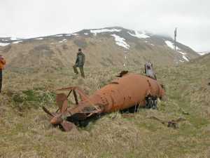 Biologist Jeff Williams near a midget submarine on Kiska Island in the far west Aleutians in 2004.