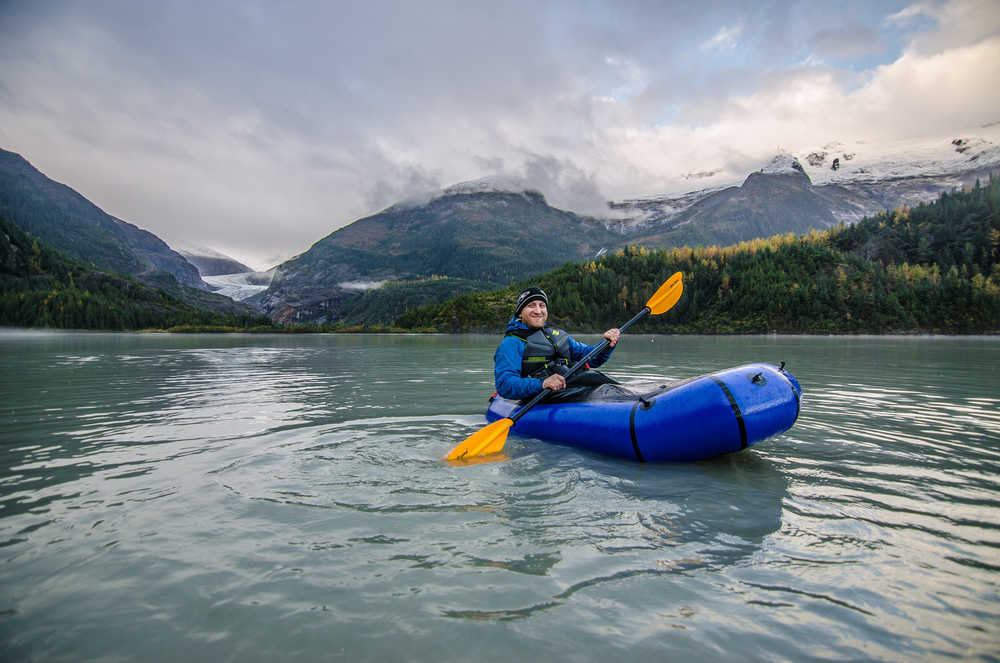 Greg Taylor packrafts Eagle Glacier Lake.