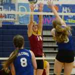 Mt. Edgecumbe's Madison Stumpf (14) attempts to block a spike by Thunder Mountain's Audrey Welling (9) during the All Comers Invitational at TMHS on Friday. Action resumes today and Saturday at Juneau-Douglas High School.