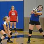 Sitka's Calista Gallant (19) bumps a ball as teammate McKenzie Fredrickson looks on during the All Comers Invitational at TMHS on Friday. Action resumes today and Saturday at Juneau-Douglas High School.