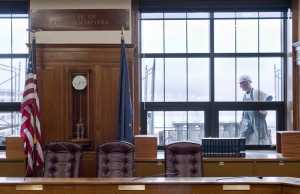 An employee of Dawson Construction works on a scaffold outside the House Finance Committee room on the fifth floor of the Capitol building on Wednesday. Workers have been getting the Capitol ready for the Special Session that starts on Saturday.