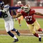 Seattle Seahawks wide receiver Jermaine Kearse (15) runs past San Francisco 49ers linebacker Michael Wilhoite (57) during the first half of an NFL football game in Santa Clara, Calif., Thursday, Oct. 22, 2015. (AP Photo/Ben Margot)