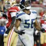 Seattle Seahawks defensive end Cliff Avril (56) reacts after sacking San Francisco 49ers quarterback Colin Kaepernick during the first half of an NFL football game in Santa Clara, Calif., Thursday, Oct. 22, 2015. (AP Photo/Marcio Jose Sanchez)