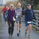 Fred Baxter, Mike McKrill and George Elgee run over an access bridge to the Mendenhall River Trail during Juneau's 1st annual PolioPlus Fun Run on Saturday. Elgee holds up his thumb and forefinger signifying "We Are This Close To Ending Polio," the motto of the event sponsored by Juneau Rotary, Juneau-Gastineau Rotary, and Juneau-Glacier Valley Rotary. One hundred percent of the entry fee goes to support PolioPlus and is matched 2-to-1 by the Bill & Melinda Gates Foundation. Contact your local rotary for more information. A slideshow of photos is online at juneauempire.com.