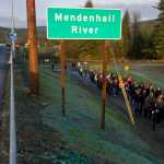 Alaska Native Brotherhood Grand President Sasha Soboleff, right, Alaska Native Sisterhood Grand President Johanna Dybdahl and Roy Peratrovich, Jr. lead a procession toward the Brotherhood Bridge for a rededication ceremony on Saturday.