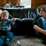 Keagan Walker, 17, right, watches as Krysta Gillen of Wrangell plays with her 10-month-old son, Sylas, during a visit in September. Keagan, born with a short femur called Proximal Femoral Focal Deficiency, has gone through nearly 20 surgeries and three limb lengthenings to his femur to make his legs the same length. Sylas was born with a shortened lower leg, called Fibular Hemimelia, and Gillen was visiting the Walker family to learn more.