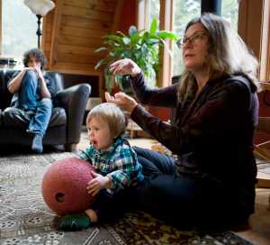 Susan Walker talks about the bone-lengthening treatment her son, Keagan, 17, left, went through after he was born with a short femur called Proximal Femoral Focal Deficiency. Krysta Gillen, mother of Sylas, a 10-month-old boy, visited the Walker family to learn more about the treatment. Sylas was born with a shortened lower leg, called Fibular Hemimelia.