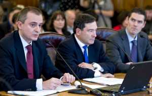 Consultants Radislov Shipkoff, director of Greengate LLC, left, Steven Kantor, managing director of FirstSouthwest, and Justin Palfreyman, director of Lazard, speak in favor of Gov. Bill Walker's TransCanada buy-out proposal during a House Finance Committee hearing at the Capitol on Saturday.