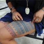 In this photo taken on Oct. 14, Marjorie Tahbone of Nome displays her birthing tattoo during the First Alaskans Institute Elders and Youth Conference in Anchorage. Tahbone has reconnected with her Inupiaq cultural heritage by practicing Inuit tattooing similar to what her ancestors wore and has been modernizing them with color and new designs.