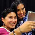 In this photo taken on Oct. 13, Marjorie Tahbone of Nome, left, and Denali Whiting, of Kotzebue, take a selfie during the First Alaskans Institute Elders and Youth Conference in Anchorage.