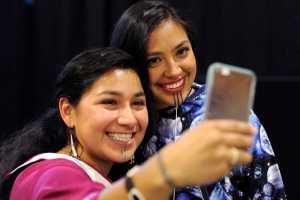 In this photo taken on Oct. 13, Marjorie Tahbone of Nome, left, and Denali Whiting, of Kotzebue, take a selfie during the First Alaskans Institute Elders and Youth Conference in Anchorage.