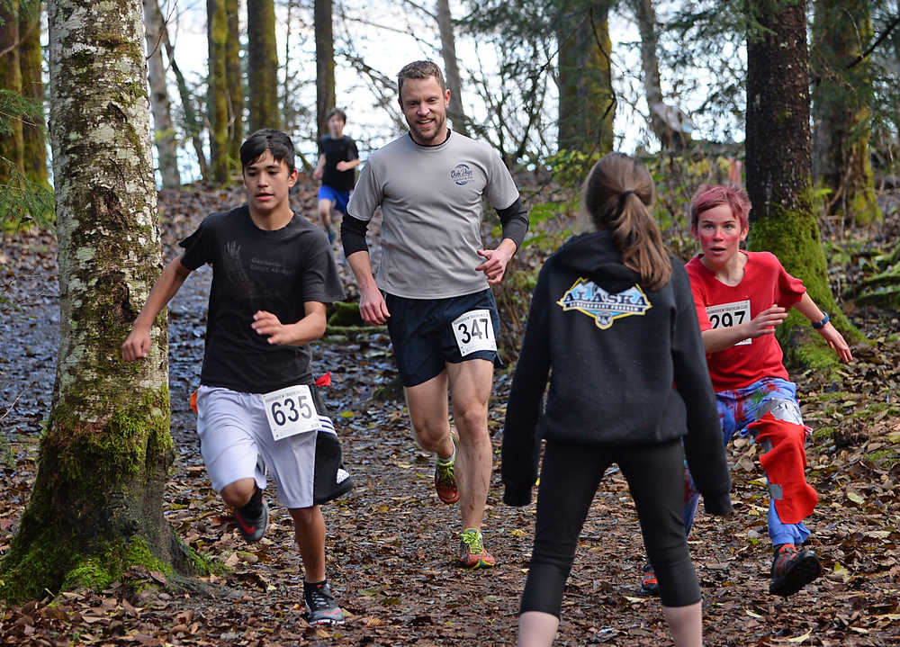 Runners navigate through zombie-infected trails during Sunday's 4th Annual Zombie Run 5K or 1-mile run on the Treadwell Trails at Sandy Beach. The event was a fundraiser for the Harborview Elementary Triathlon Club.