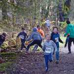 Runners scramble as zombies attack during Sunday's 4th Annual Zombie Run 5K or 1-mile run on the Treadwell Trails at Sandy Beach. The event was a fundraiser for the Harborview Elementary Triathlon Club.