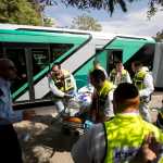 In this Oct. 13 photo, Israeli ZAKA emergency response members carry the body of an Israeli at the scene of a shooting attack in Jerusalem.
