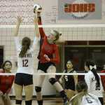 Juneau-Douglas senior Maddie McKeown (14) spikes a shot against Ketchikan this season as senior teammates Tona Fogg (9) and Kallen Hoover (11) look on. The Crimson Bears will host the Thunder Mountain Falcons on Saturday for JDHS Senior Appreciation at JD gym. TM hosts JD on Friday for Falcons senior night.