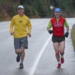 Jim Ustasiewski and John Bursell run along North Douglas Highway on Saturday. Bursell is training for the Boston Marathon on April 18, Patriots' Day in the Commonwealth of Massachusetts. Ustasiewski is just training.