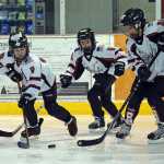 The Juneau Douglas Ice Association youth hockey Juneau Capitals Squirts teams, born in 2005-2006, battle on the ice on Halloween Saturday at the Treadwell Ice Arena.