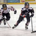 The Juneau Douglas Ice Association youth hockey Juneau Capitals Squirts teams, born in 2005-2006, battle on the ice on Halloween Saturday at the Treadwell Ice Arena.