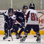 The Juneau Douglas Ice Association youth hockey Juneau Capitals Squirts teams, born in 2005-2006, battle on the ice on Halloween Saturday at the Treadwell Ice Arena.