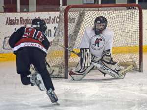 The Juneau Douglas Ice Association youth hockey Juneau Capitals Squirts teams, born in 2005-2006, battle on the ice on Halloween Saturday at the Treadwell Ice Arena.