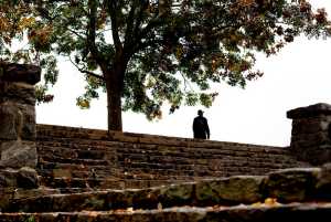 Fallen leaves lay on the ground as a man walks through Piedmont Park Wednesday in Atlanta.