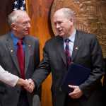 Gov. Bill Walker shakes hands with Sen. Anna MacKinnon, R-Eagle River, left, Rep. Steve Thompson, R-Fairbanks, and Rep. Mark Neuman, R-Big Lake, right, after signing the bill to buyout TransCanada's share of the AKLNG project at the Capitol on Thursday.
