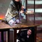 Johanna, played by Jessica Skiba, hides from the beggar woman, played by Christina Apathy, during a rehearsal of Perseverance Theatre's musical production of "Sweeney Todd: the Demon Barber of Fleet Street."