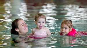 Jennifer Narvaez swims with her daughters, Mary, 2, center, and Margaret, 4, at the Dimond Park Aquatics Center on Thursday, Nov. 5.
