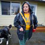 Sandi Hicks, 71, takes her dog, Rikku, out for a walk Friday. Hicks brought public attention to the feral rabbit outbreak in the Mendenhall Valley after her dog torn its ACL chasing one and she presented the city with the $3,000 veterinarian bill.