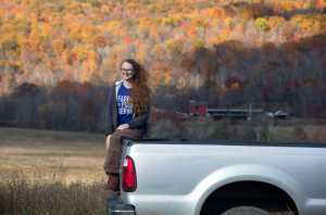In this Oct. 30 photo, Leanna Mulvihill poses at the Hudson Valley Farm Business Incubator in New Paltz, New York. Mulvihill grazes her pigs and lambs on about 50 acres at the incubator.