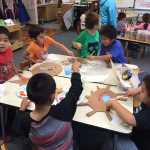 Angoon kindergarten and first grade students work on the backdrop and props for their upcoming play, "Raven Stole the Sun."