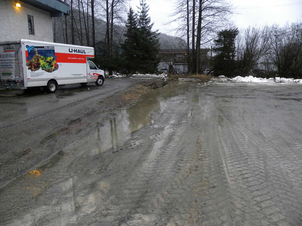 In heavy rain, water runs off the parking lot by CCTHITA and drains directly into Jordan Creek.