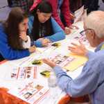 Putting food on the… lunch table?: Thunder Mountain High School senior Sara Wood is trying to figure out if she can afford groceries for children and make charitable donations - all on a registered nurse's salary. Wood doesn't actually have children, nor does she plan to become a registered nurse, but the "Get Real Financial Reality Fair" Thursday at TMHS was an exercise to help students prepare for whatever life has for them after they cross the stage with their degrees. During the fair volunteers from the community sold them life insurance, asked for donations and hooked them up with premium cable. After the real world simulation, four participants walked away with scholarships totaling $500 in a random drawing. The event was organized by the Financial Reality Foundation and sponsored by True North Federal Credit Union.