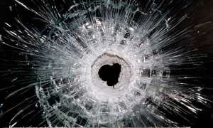 A bullet hole is seen Sunday in the window of the restaurant on Rue de Charonne, Paris, where attacks took place on Friday.