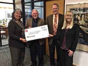 Left to right: Phyllis Carlson, CIS board chair; Kelly Tonsmeire, CIS board vice chair, Michael Byer, CIS executive director, and Karen West, Wells Fargo vice president.