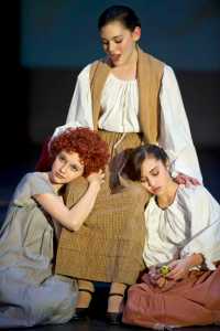 Ava Meade, center, plays the loving mother with her own daughter played by Clara Smith, right, who helps Annie Warbucks, played by Kayla Kohlhase, get back to her father, Daddy Warbucks. Theater at Latitude 58 presents "Annie Warbucks" at the Thunder Mountain High School auditorium Friday, Nov. 20 at 7 p.m., Saturday, Nov. 21, 2 p.m. & 7 p.m. and Sunday, Nov. 22, 2 p.m.