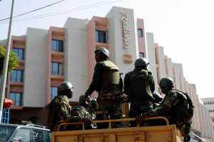 Soldiers from the presidential patrol outside the Radisson Blu hotel in Bamako, Mali, Saturday in anticipation of the President's visit.