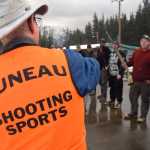 Shooters listen to a range safety officer explain the rules of the Annie Oakley contest on Saturday, Nov. 21, 2015 during the Juneau Gun Club's annual Turkey Shoot fundraiser. During the Annie Oakley, a line of shooters is invited to fire shotguns in sequence at clay pigeons. If a shooter misses the pigeon, he is eliminated if the next shooter in line can destroy the flying target. Juneau Shooting Sports is a co-sponsor of the event with the Gun Club.