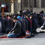 In this photo taken Nov. 13, men attend a Friday prayer at the mosque on Kotrova street in Dagestan's regional capital Makhachkala, Russia.