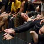 In this photo taken Nov. 3, Taylor Haines laughs with her Dance Contempo friends at the close of a dress rehearsal in Anchorage.